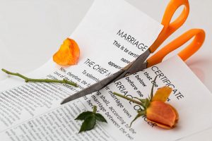 Marriage Certificate Being Cut By Scissors